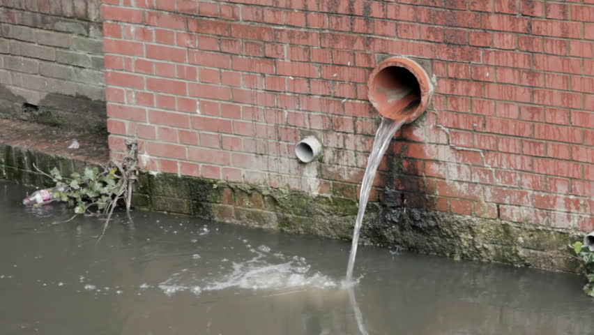 Pipe overflowing into canal