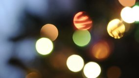 Video of Christmas tree with lights, selective focus