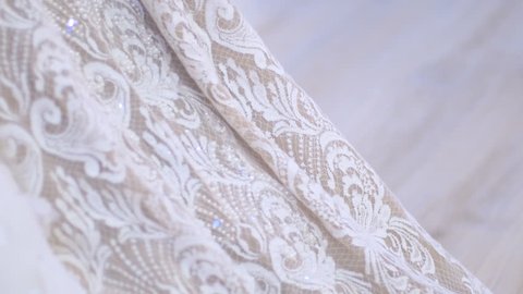 Close-up: the decoration of wedding dress – Stockvideo