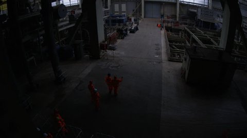 4K Team of workers at fuel plant come up from underground and walk into daylight (UK-Oct 2016)