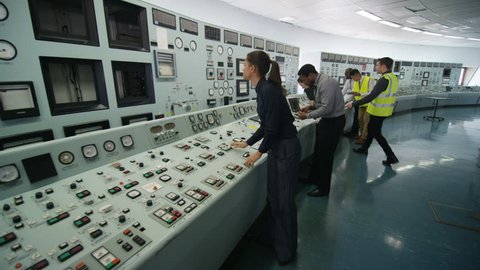 4K Mixed ethnicity team of engineers working in power station control room (UK-Oct 2016)