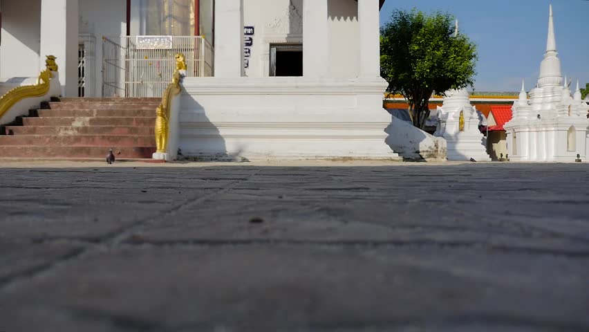 Monk walking in buddhist temple