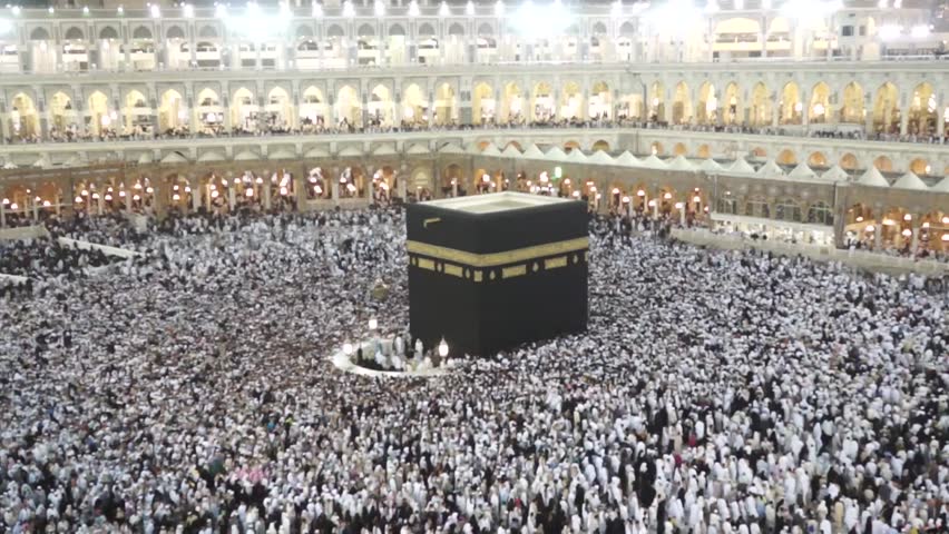 Muslim pilgrims circumambulate the Kaaba at Masjidil Haram on February 22, 2012 in Makkah, Saudi Arabia. Muslims all around the world face the Kaaba during prayer time.  Royalty-Free Stock Footage #2181982