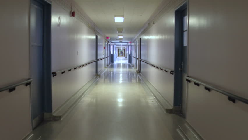 Steadicam walking down hospital hallway