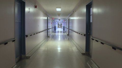 Steadicam walking down hospital hallway
