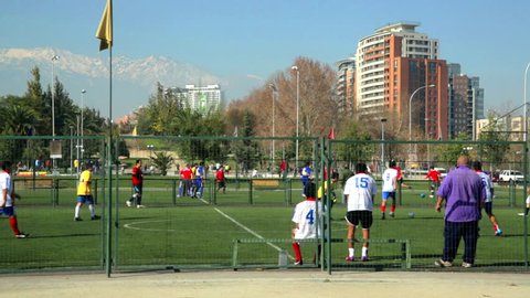 Santiago/Chile, July 2. People playing a soccer friendly game at park in Santiago de Chile. Every day friends and soccer fans play the futsal style of soccer
