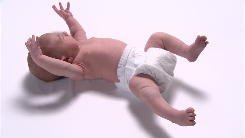 Side view of newborn baby's moving body