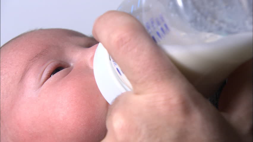 Closeup of feeding newborn milk