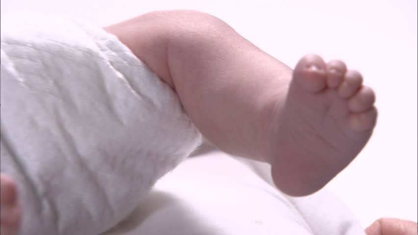 Closeup of newborn baby's moving foot