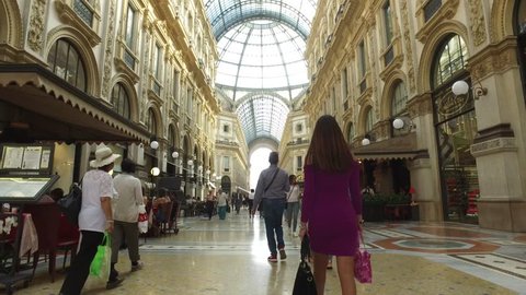 MILAN, ITALY - CIRCA SEPTEMBER, 2016: POV view of Vittorio Emanuele II Gallery with dome. It's one of the world's oldest shopping malls, designed and built by Giuseppe Mengoni between 1865 and 1877. 