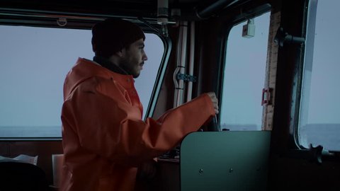 Captain Pilots Commercial Fishing Ship. Shot on RED Cinema Camera in 4K (UHD).