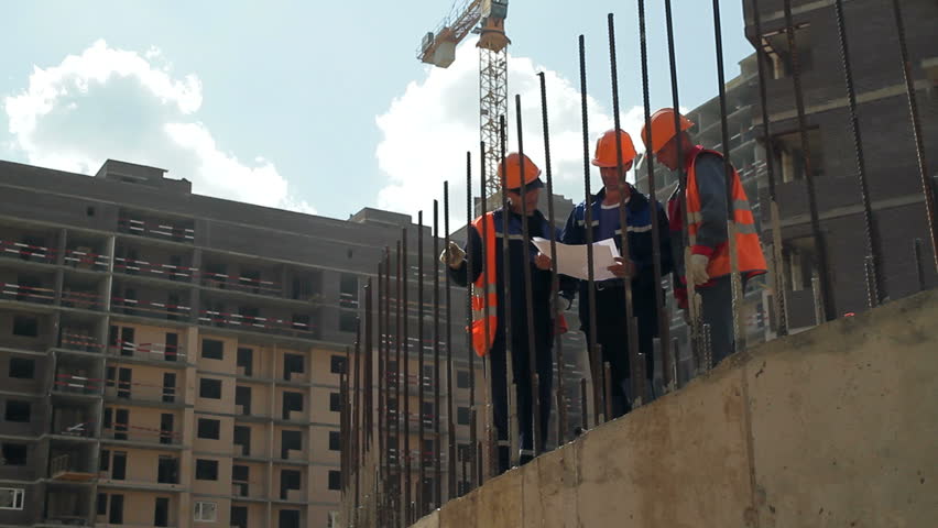 9.05.2016 Moscow,Russia. Construction site engineers are discussing a workplan. Dolly shot ,fittings in the foreground | Shutterstock HD Video #21843880