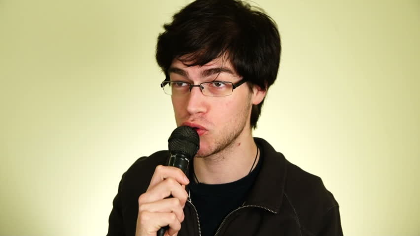 Man talking into a microphone.