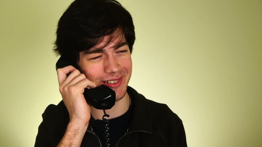 Young happy man on the phone.