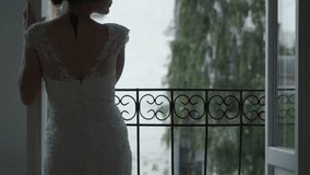 Beautiful bride standing near a window