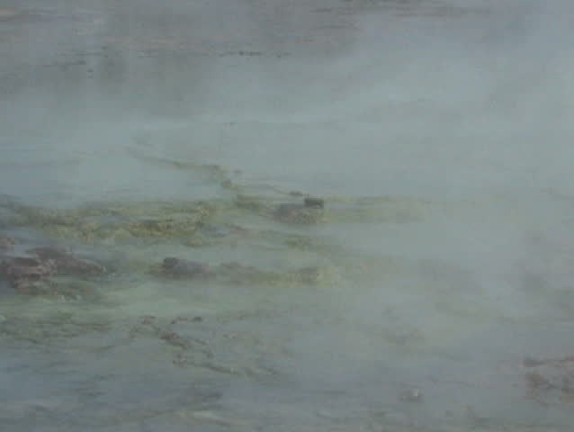 Steam flowing over Yellowstone National Park at dawn