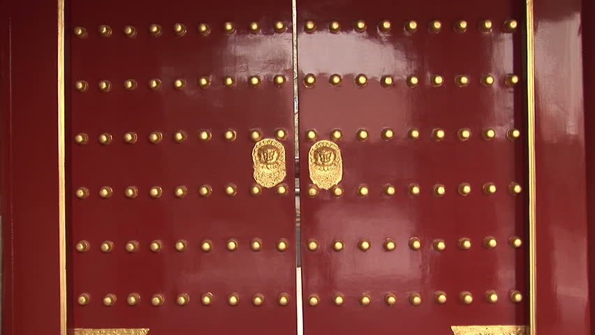 Traditional chinese doors with gold lion handles, Summer Palace, Beijing, China, zoom in. Format: NTSC HDV Compression: MotionJPEG-A Camera: Sony HVR-Z1U Size: 1080i (1920 x 1080) Sound: No