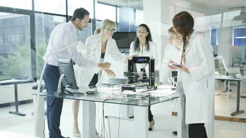 4K Scientific research engineers working in lab with computer and 3D printer (UK-Oct 2016) | Shutterstock HD Video #21854821