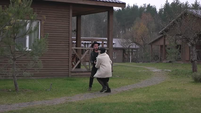 couple running in autumn countryside.