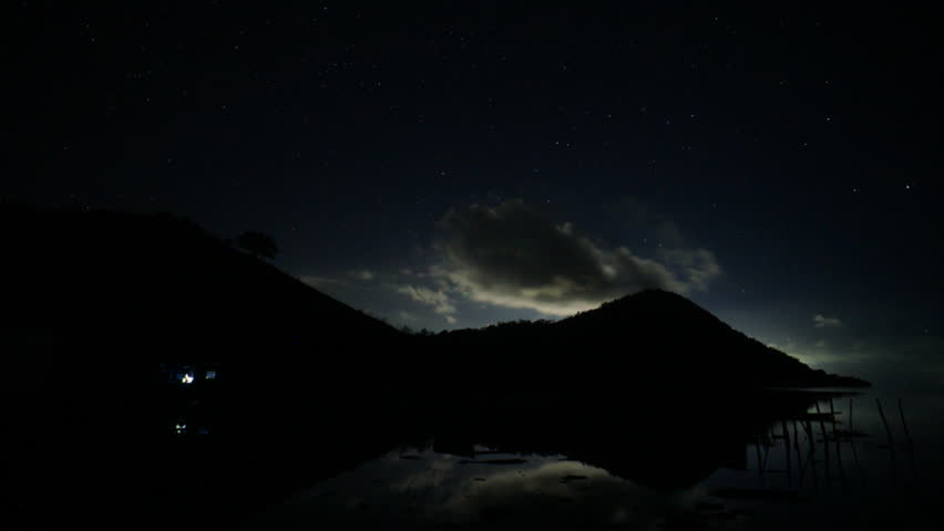Star trails in the sky with dancing cloudy over the Timbun Mata island,Semporna,Sabah,Borneo.
