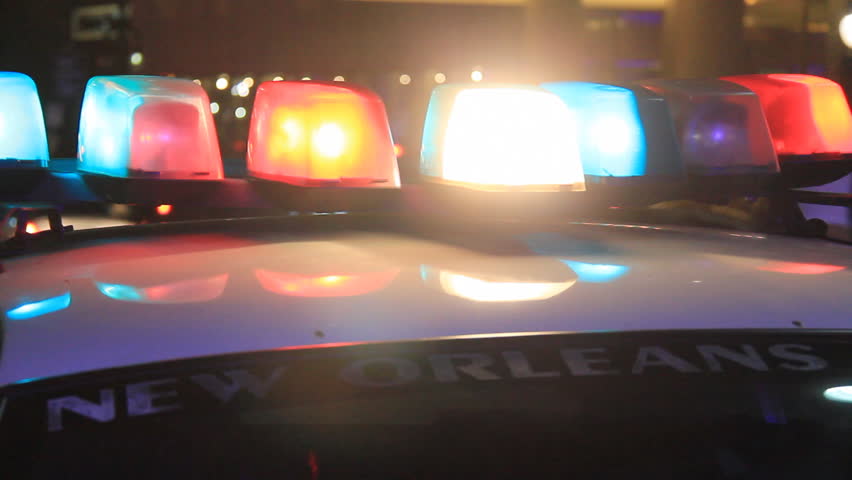 A New Orleans police squad car with its lights running