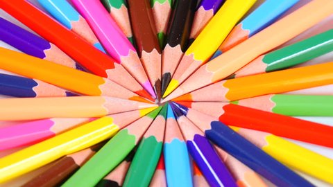 Colorful pencils point to centre and form bright circle, creativity, imagination, art, sharp ends, stationery. Close up, seamless loop, 4K Ultra HD.
