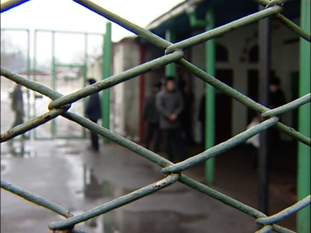 Looking through fence of prison