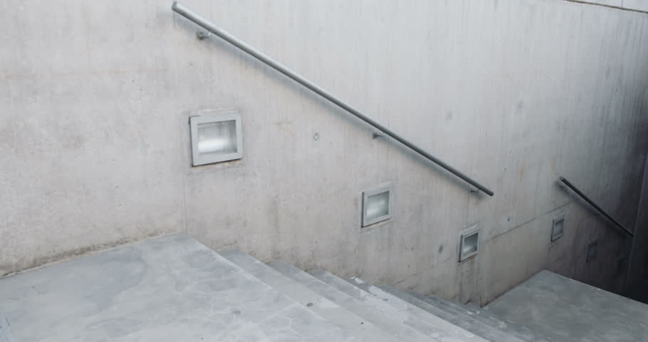 Athletic man running intervals on stairs