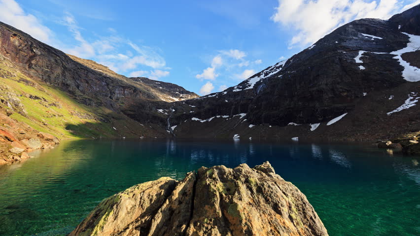 The Troll Lake, or Trollsjön Rissajaure in Swedish, is a green and blue lake in northern Sweden close to Kiruna. July 11 2016. Slider timelapse.