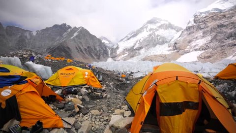 EVEREST BASE CAMP, NEPAL - APRIL 30, 2016: View of tents established on Khumbu Icefall for tourists' convenience, Everest base camp. Picturesque mountains are on the background. Himalaya, Nepal