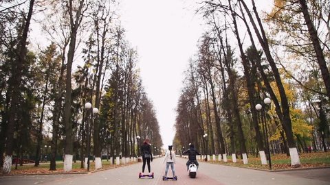 young people ride on gyroscooter and electric bike