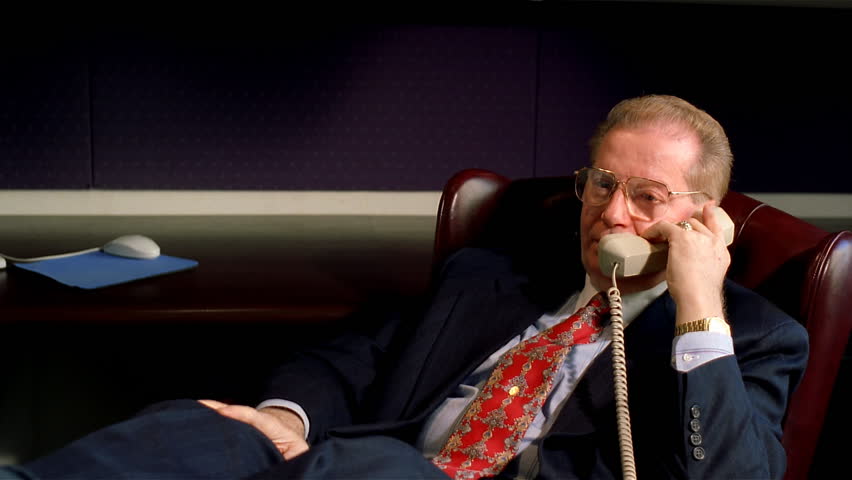 Relaxed executive on the phone