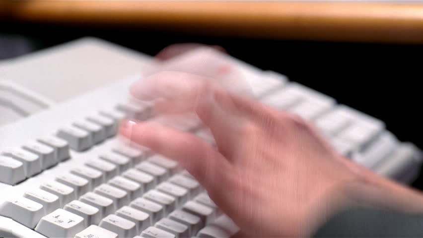Closeup of man's hands typing fast