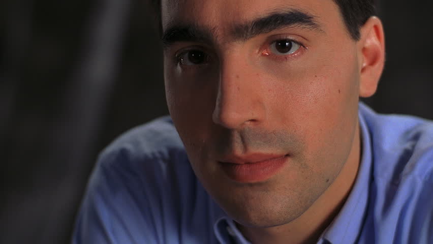 Closeup of serious young Hispanic man
