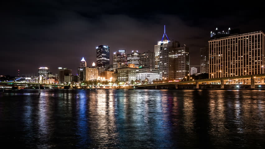 Night to day timelapse with sunrise behind Pittsburgh, Pennsylvania downtown skyline
