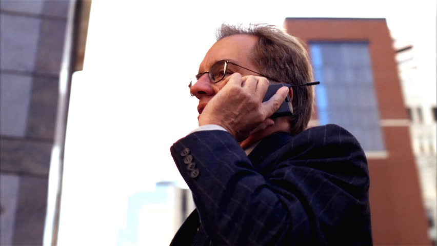 Closeup of businessman talking on cellphone