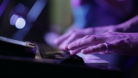 hands of musician playing keyboard in concert - Powered by Shutterstock - Get 15% off with code: PIKWIZARD15