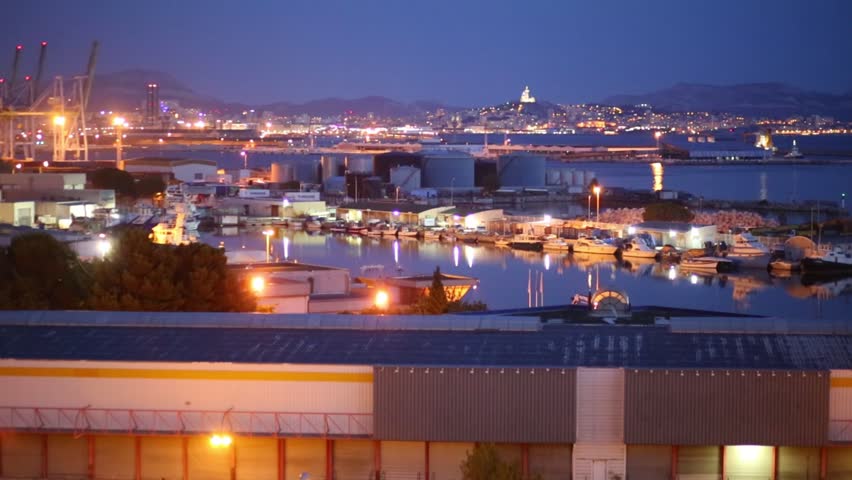 Evening seascape with harbour and mountains in Marseille, France
