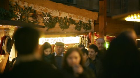 STRASBOURG, FRANCE - CIRCA 2016: Market stall preparing traditional mulled wine from organic ingredients at Christmas Market waiting for customers