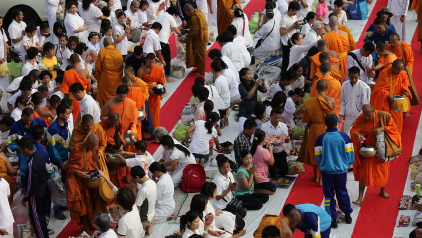BANGKOK - MARCH 17: Monks are participating in a Mass Alms Giving of 12,600