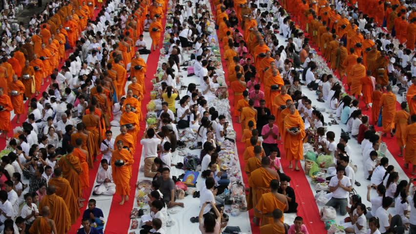 BANGKOK - MARCH 18: Monks are participating in a Mass Alms Giving of 12,600