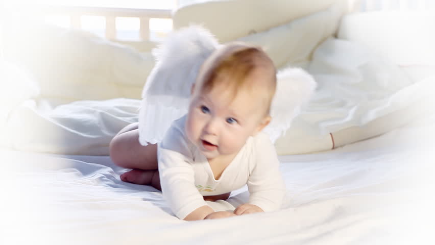 Baby angel on the bed