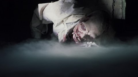 Horror scene of a scrambling dead zombie, halloween