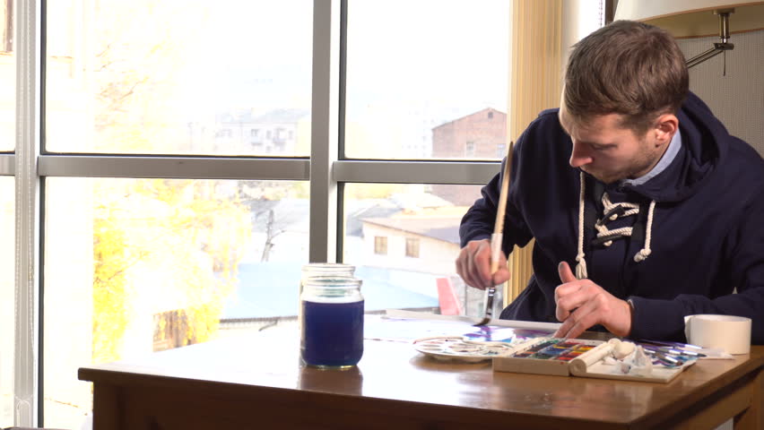 Artist working on painting