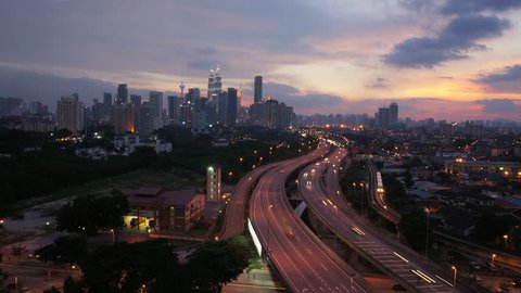 Time lapse of Kuala Lumpur skyline sunset with flashes of lightning