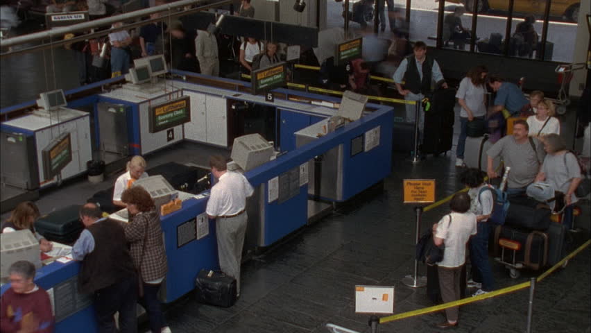 BOSTON, MA - CIRCA 2001 - (Fast motion) Busy airport terminal