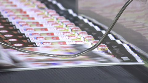 print plant factory, magazine transports on conveyor belt line after printing units and folder