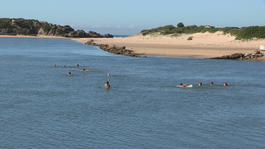 People swimming in estuary at Kenton on sea
