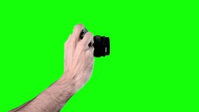 Man photographing on green screen chroma key