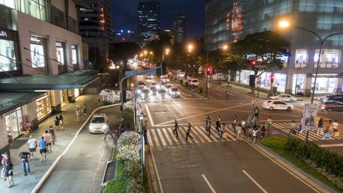Manila, Philippines - December 3, 2016: Timelapse of a night traffic in Makati City shopping districts in Metro Manila. Philippines.
